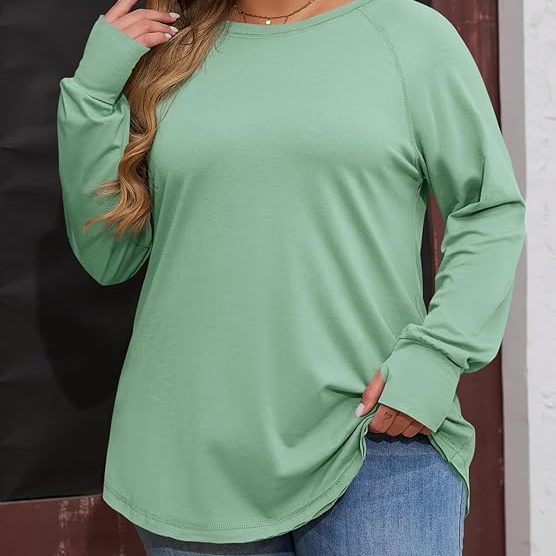 Plus-size oversized athleisure tunic top providing comfortable coverage for belly and hips with a relaxed, flattering fit.